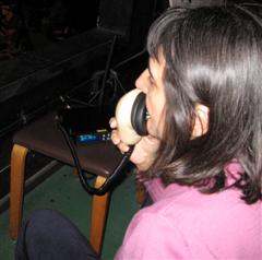 Image of describer speaking into mask mic.
