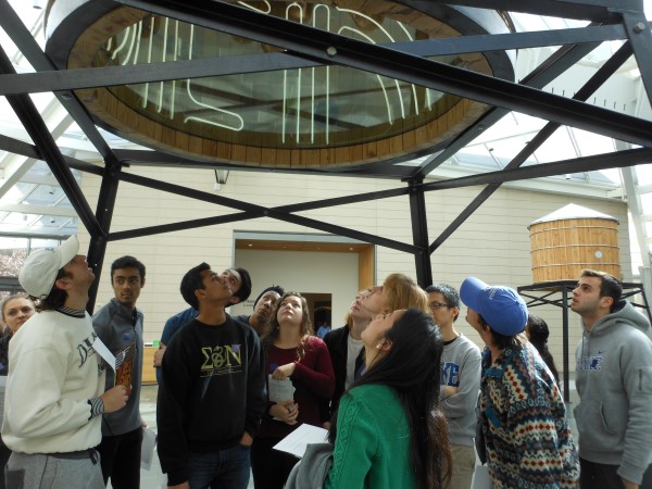 Students Look Up Into Tower