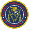 FCC Seal, red letters on a dark blue circle